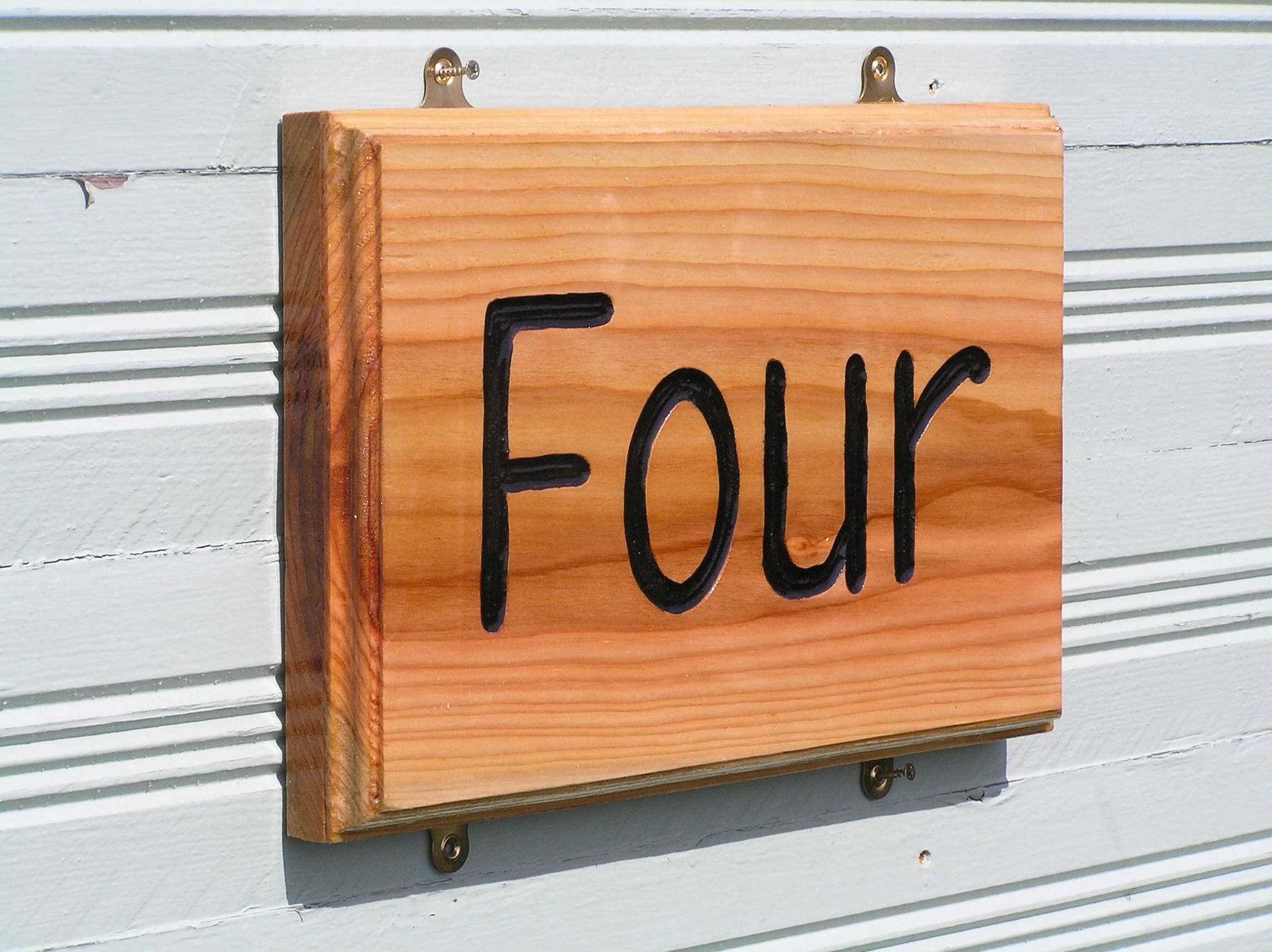 Sustainable wooden written number house sign by ingrained culture