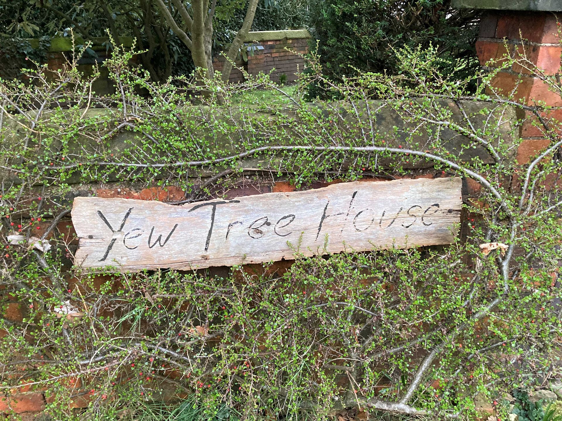 A run down old house sign