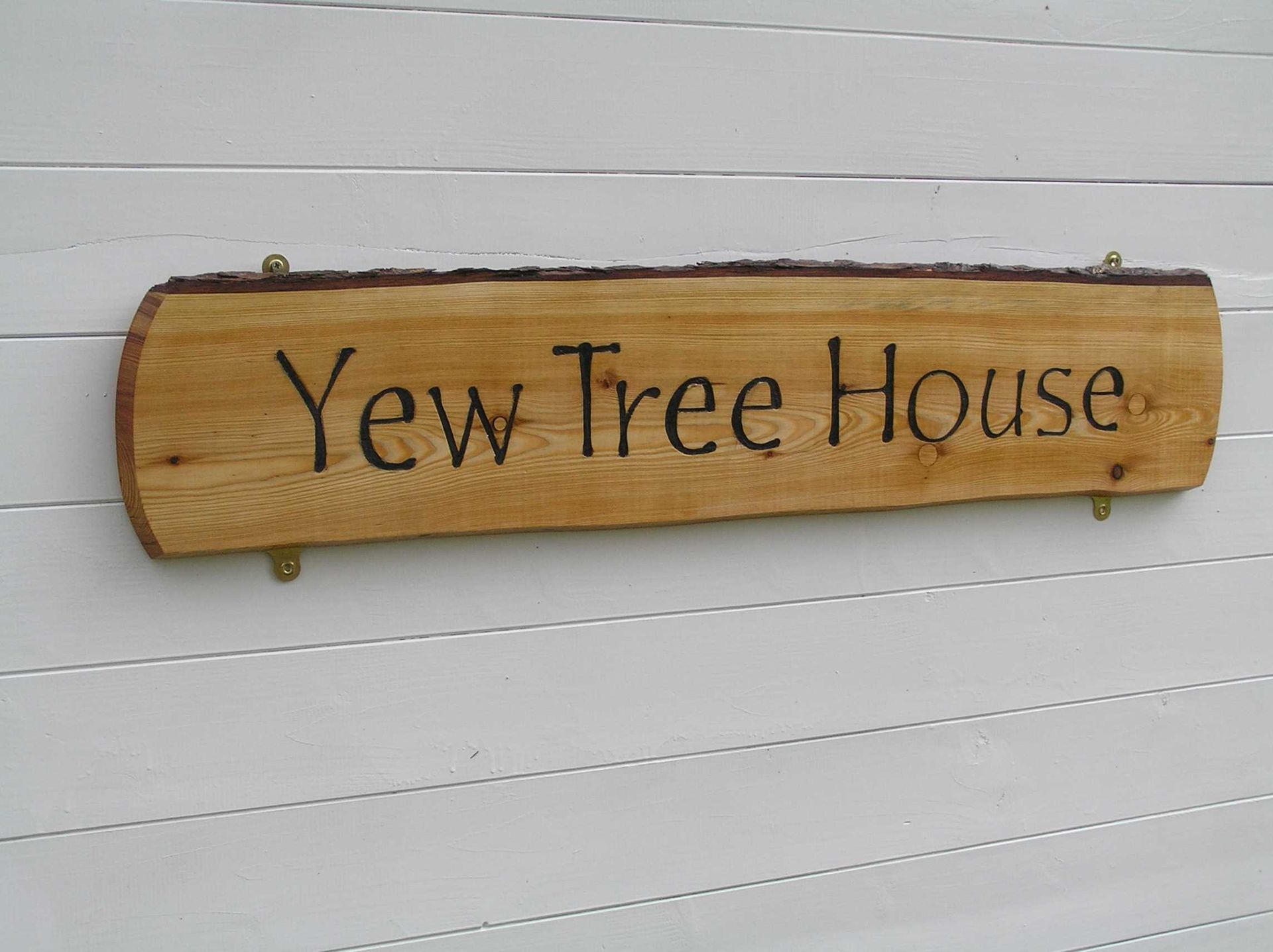 An on trend natural wooden house sign made by Ingrained Culture