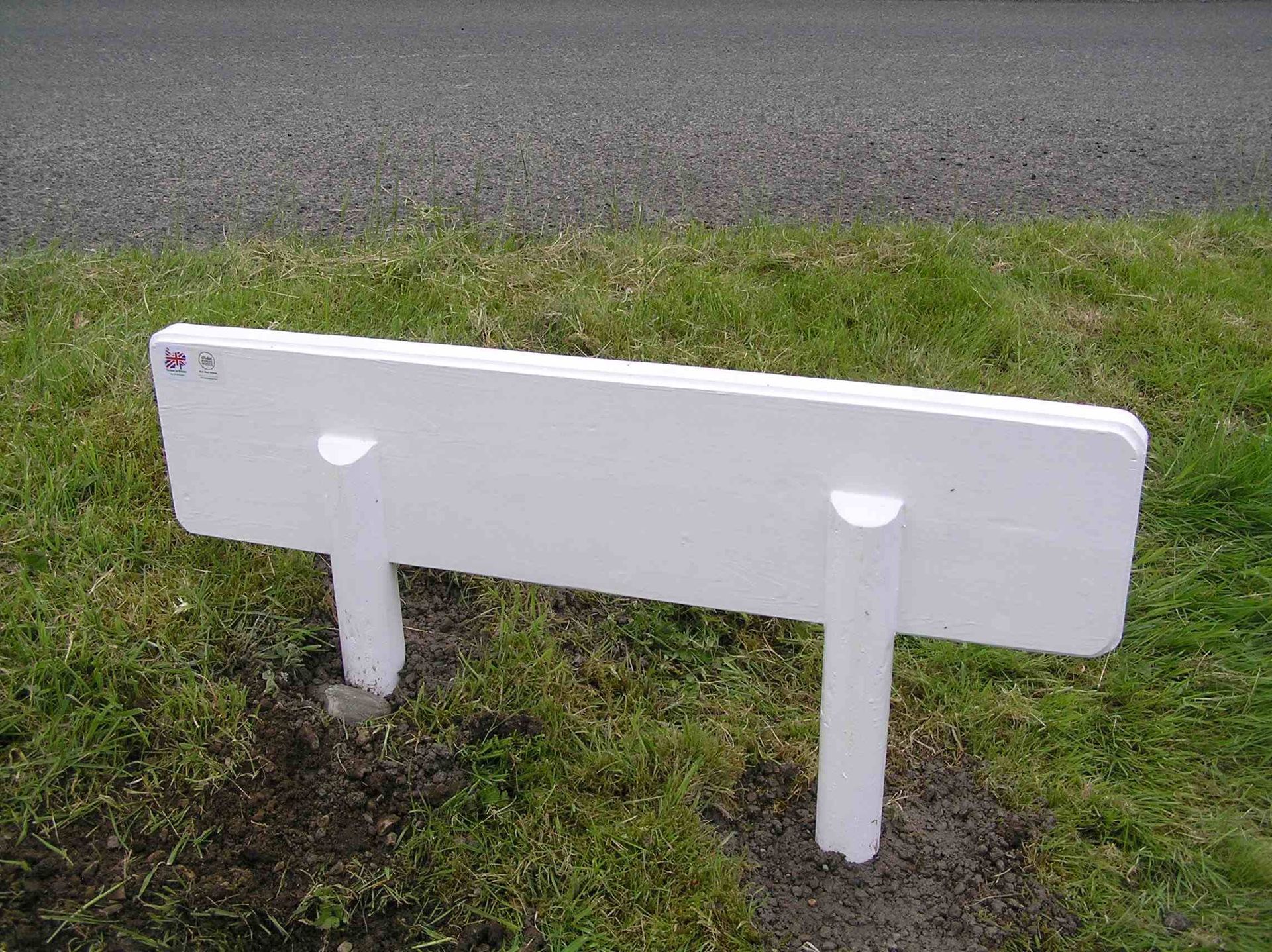 rear view of an Ingrained culture wooden house sign showing round posts