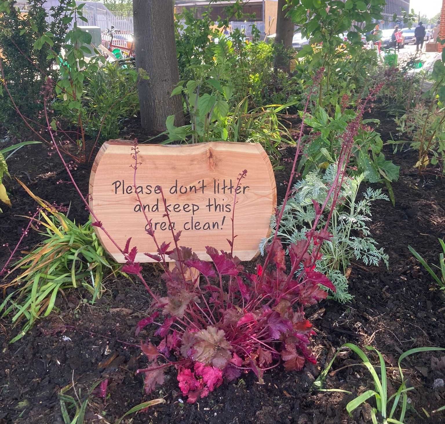 An anti litter Eco friendly wooden business sign made by Ingrained Culture