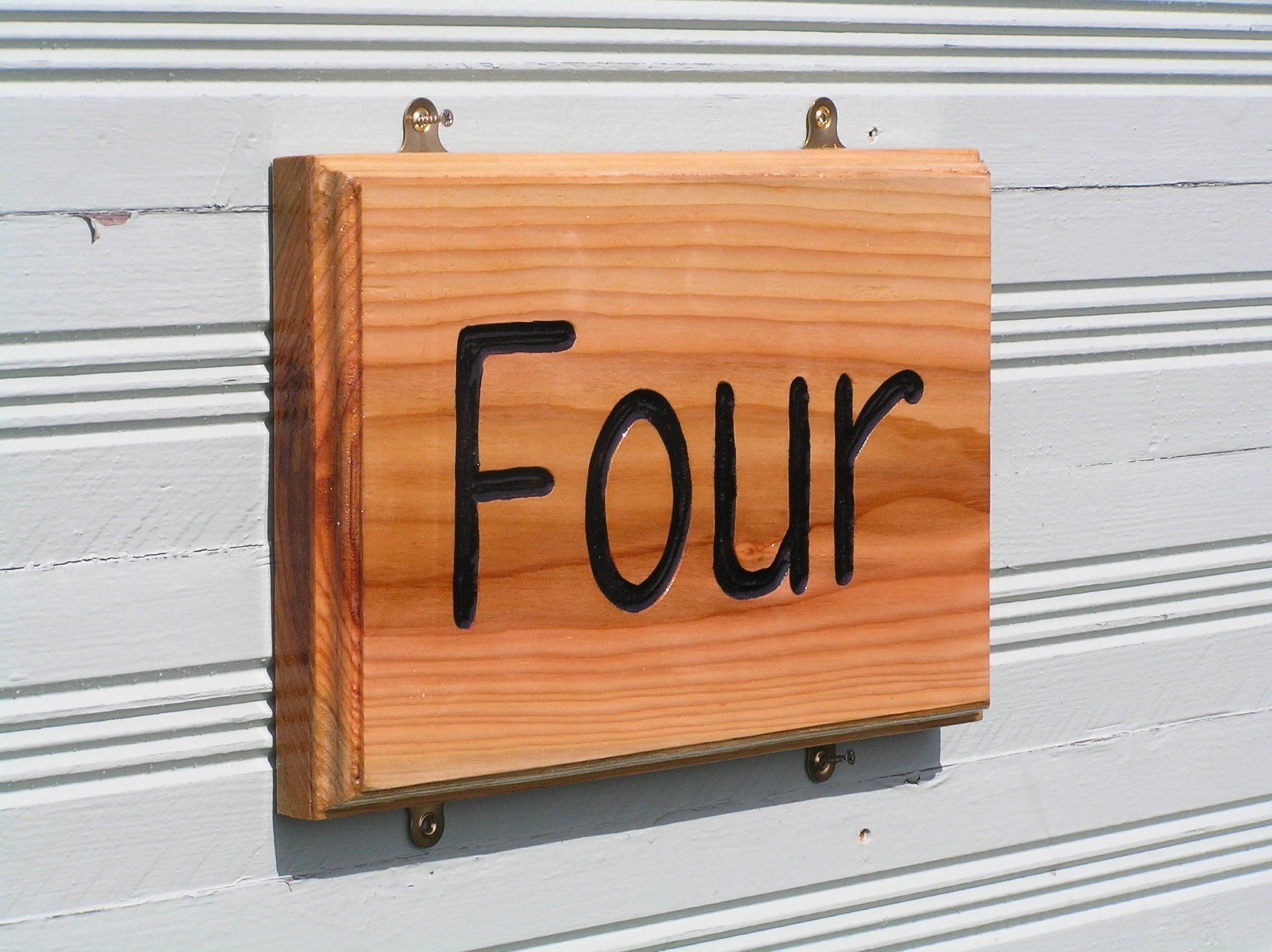 Sustainable wooden written number house sign by ingrained culture