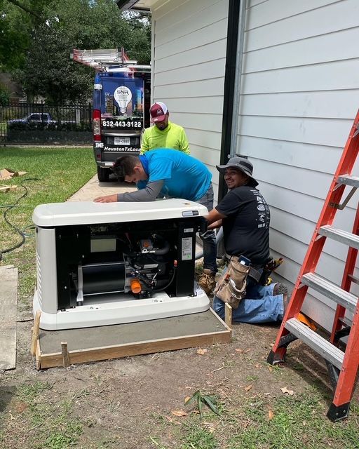 Two workers install a white generator beside a house, with a ladder and power equipment nearby.