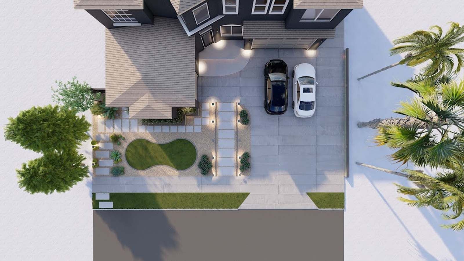 Top-down view of a house with a dark exterior, driveway with two cars, and landscaped yard with greenery.