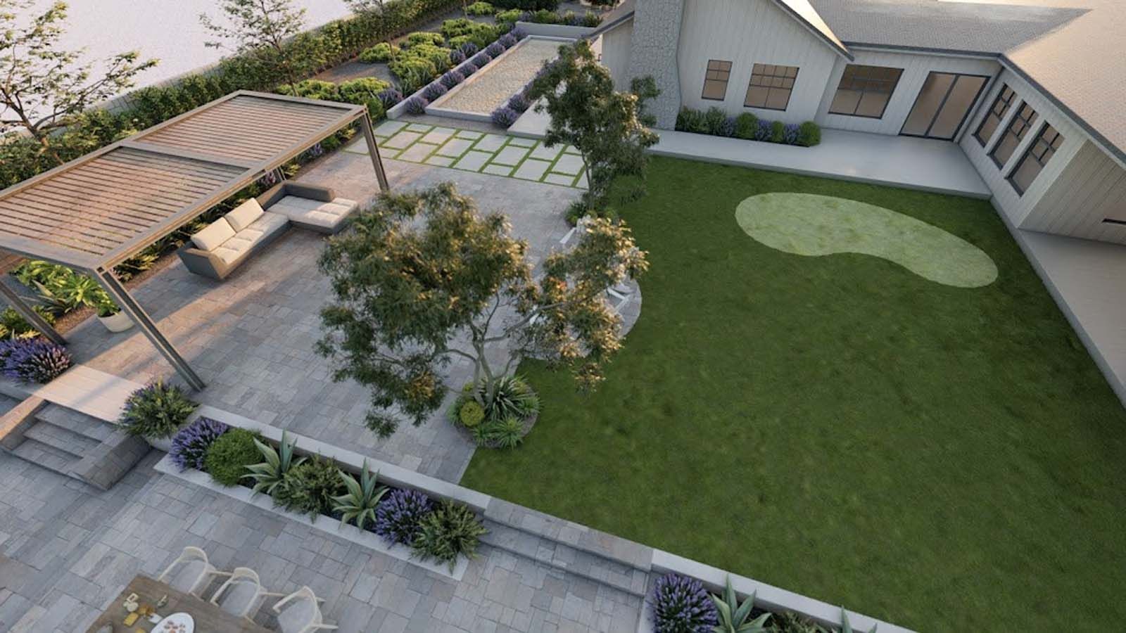 An aerial view of a modern backyard with patio, lawn, pergola, and a house with white exterior.
