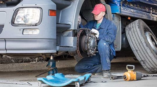 Mechanic repairing break — Auto Repair in Rockhampton, QLD
