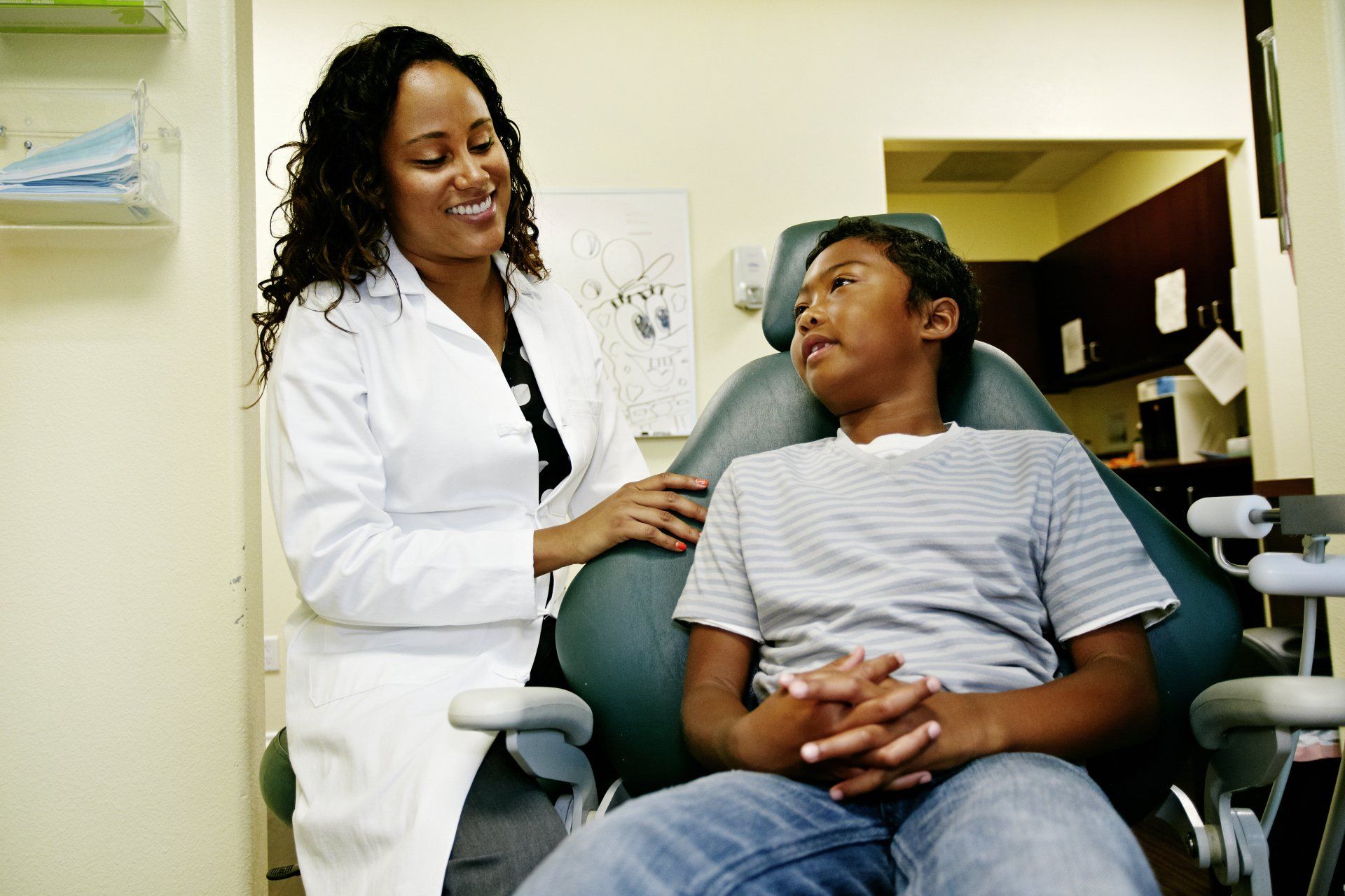 Dentist with young patient — Jackson, MS — Central MS OMS