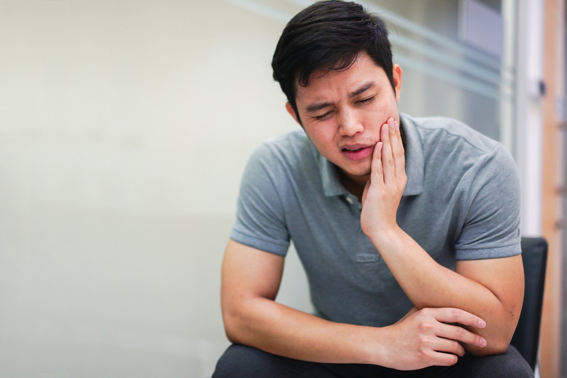 Man experiencing TMJ disorder — Jackson, MS — Central MS OMS