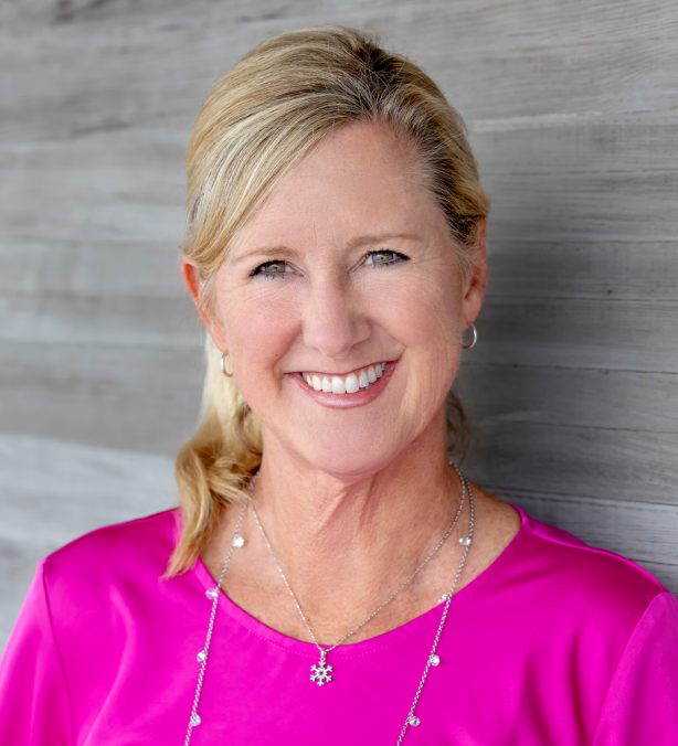 Woman in pink shirt and blonde hair