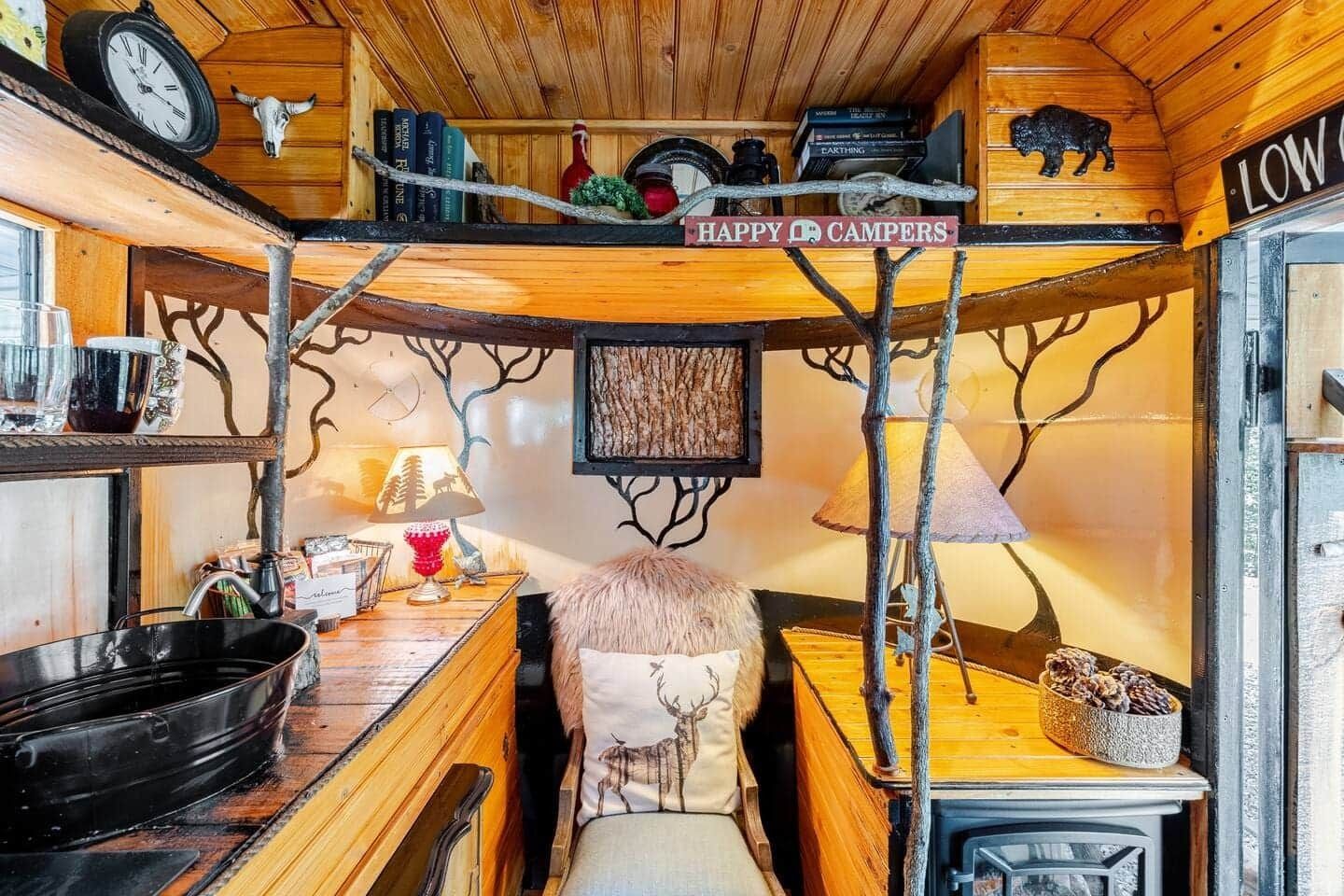 A small room with a bunk bed and a sink.