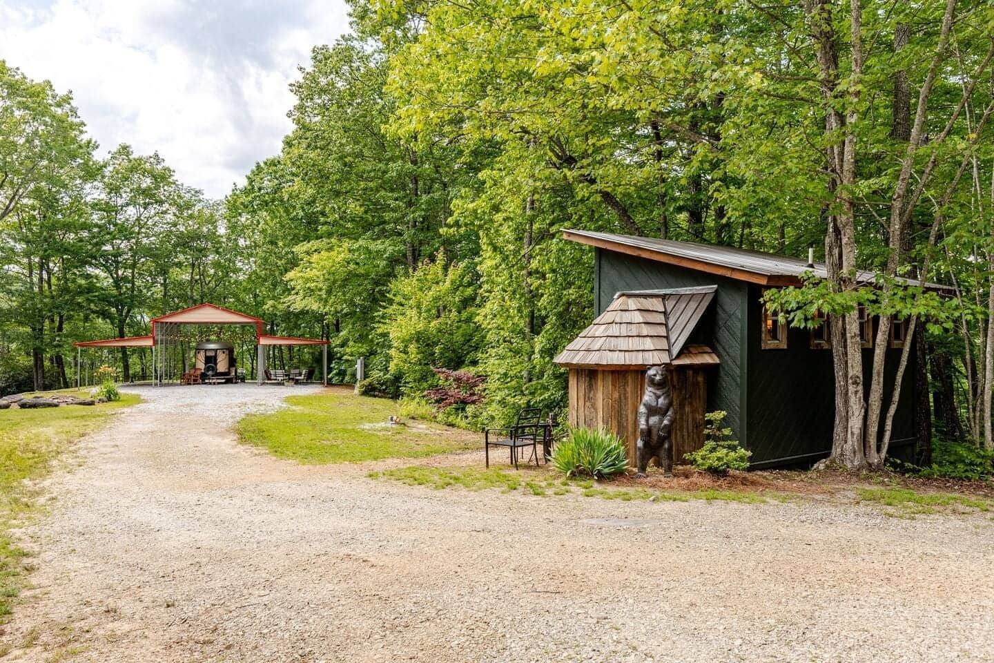 There is a small house in the middle of the woods.
