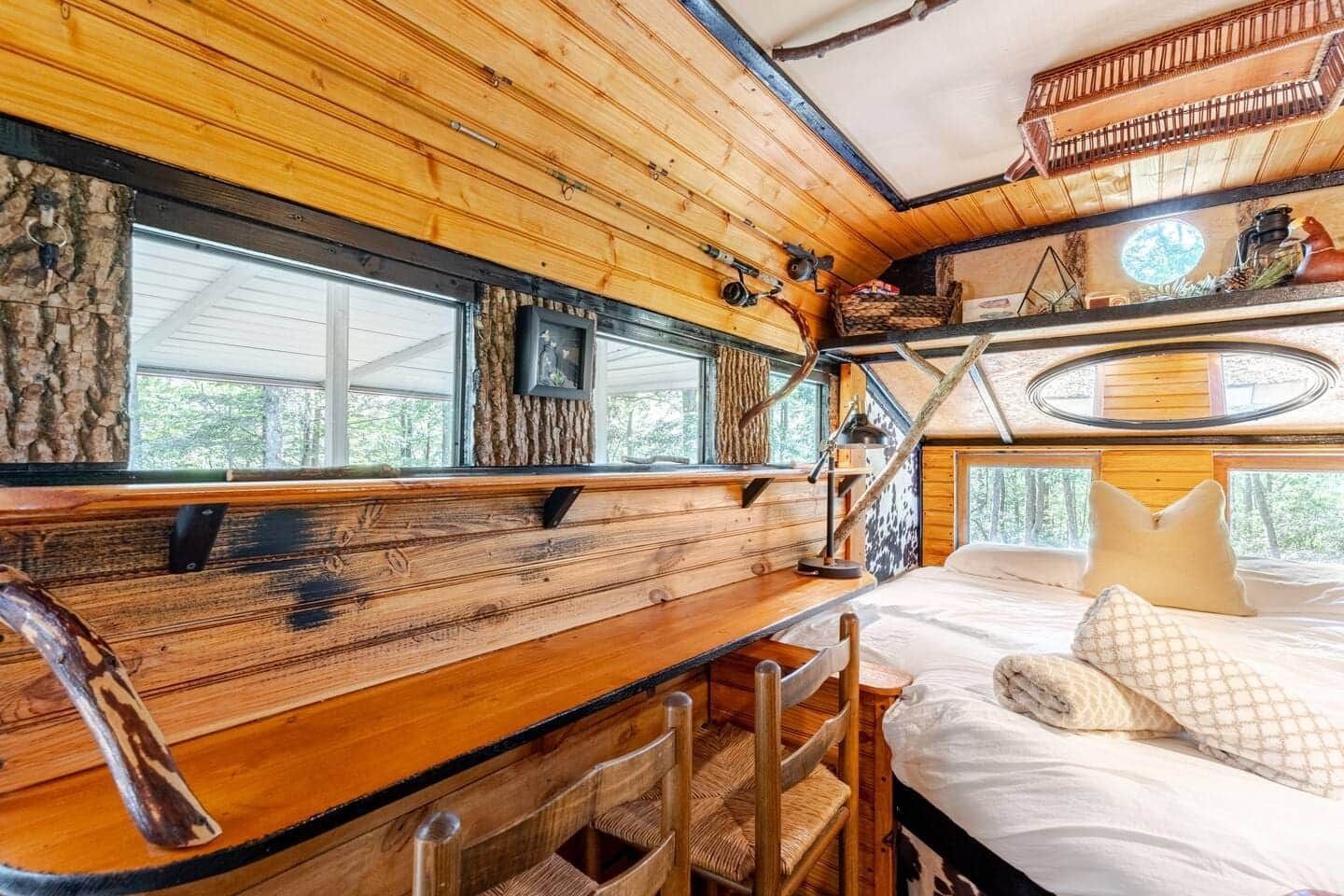 There is a bed and a desk in the room.