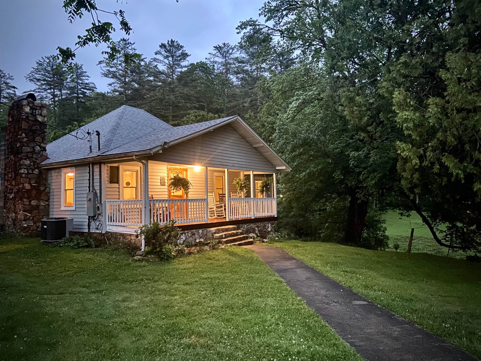 A house with a porch and a walkway leading to it