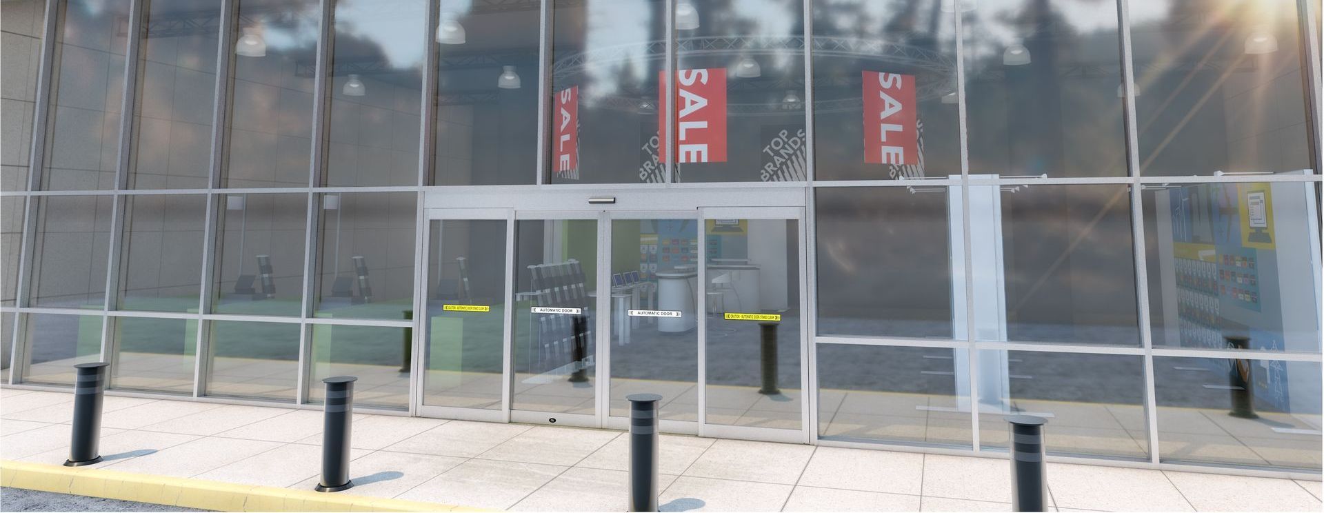 Vitrine vitrée avec des panneaux rouges « SOLDES » et portes closes derrière des bornes noires sur un trottoir