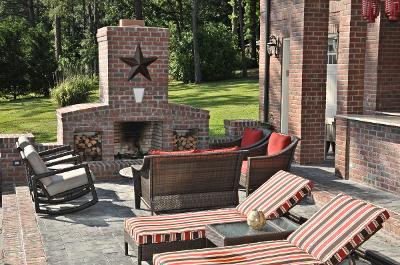 patio with brick fireplace and outdoor seating
