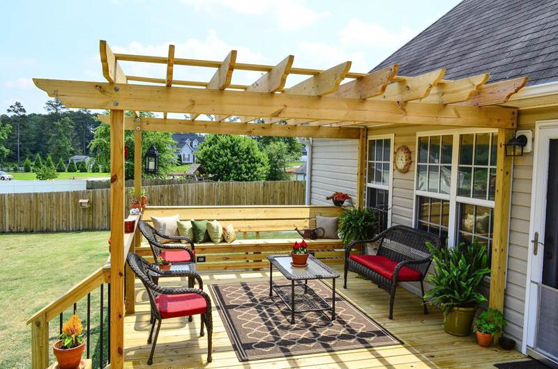 deck off back of house with pergola attached