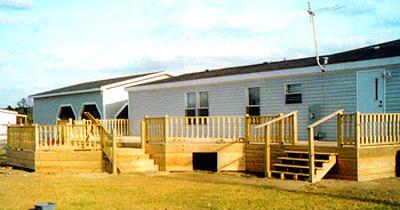 large deck on back of house with 2 sets of stairs