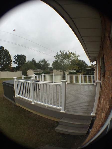 stairs leading to deck with jacuzzi