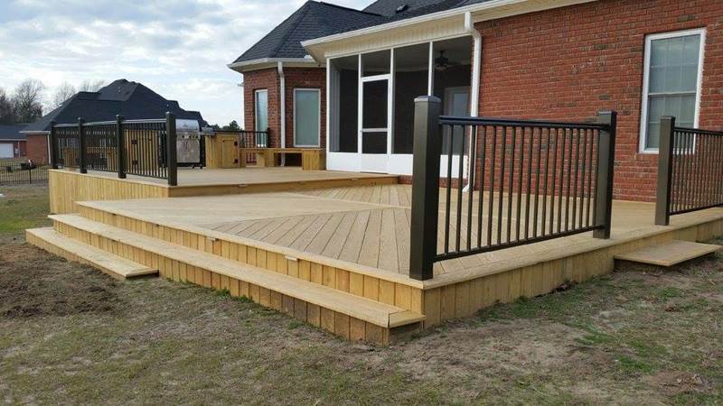 new deck with black metal railing