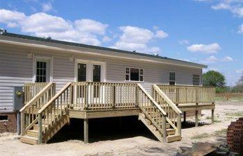 new deck on back of house with 2 sets of stairs