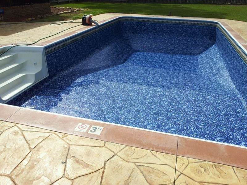 inground pool being filled after repairs