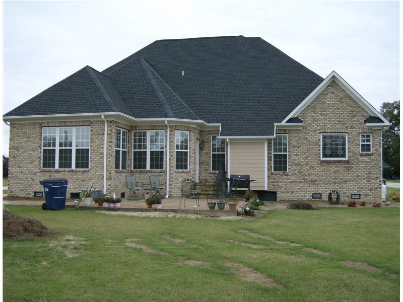back yard with patio off brick house