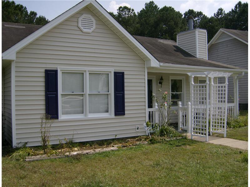 new siding and trellis leading to updated porch