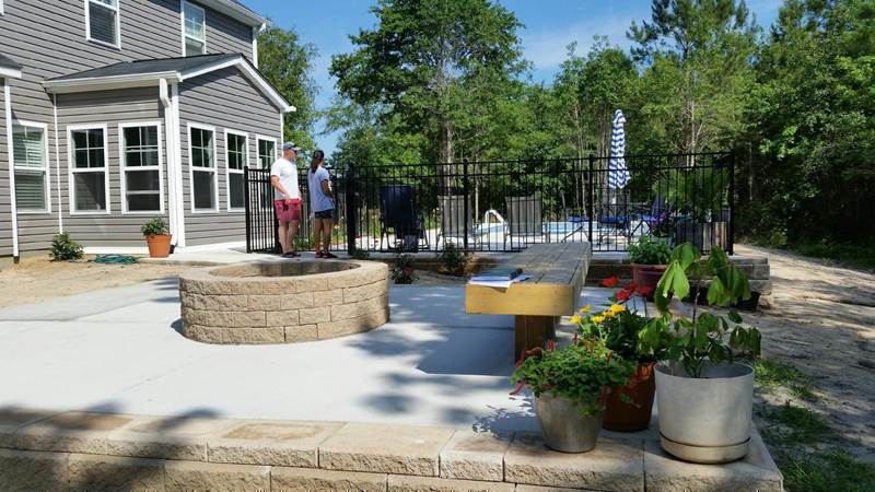 built-in fire pit outside pool area