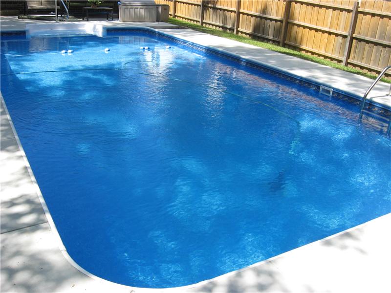 inground pool with cement surround