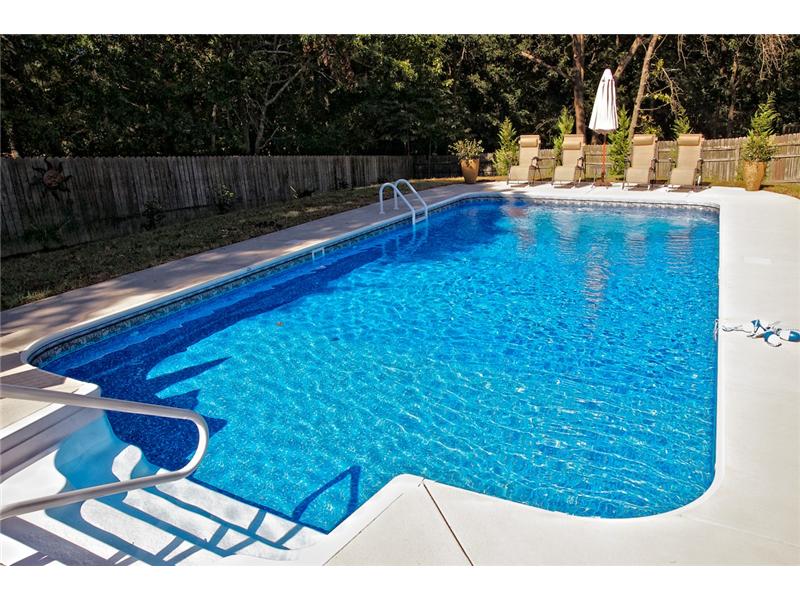 stairs with handrail leading into pool