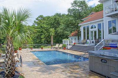 pool with hot tub and  palm tree on surrounding decking