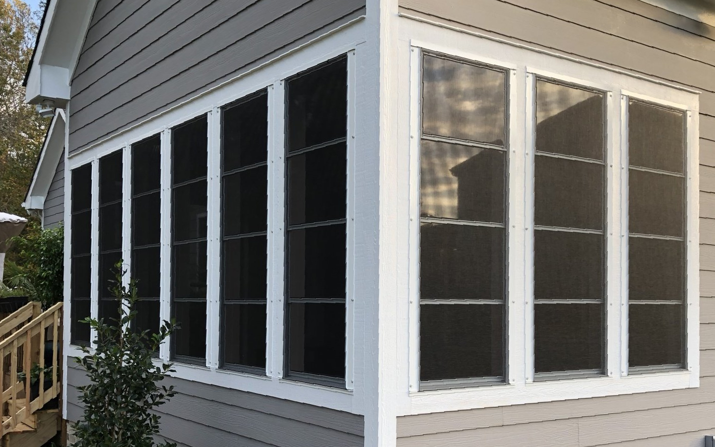 corner view of wall of windows on sunroom