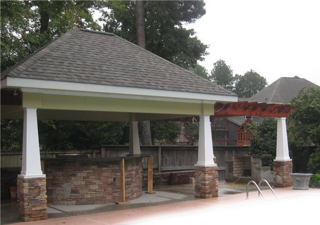 covered area with outdoor kitchen under construction