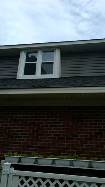 double window on second floor of house
