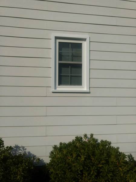 small single window on side of house