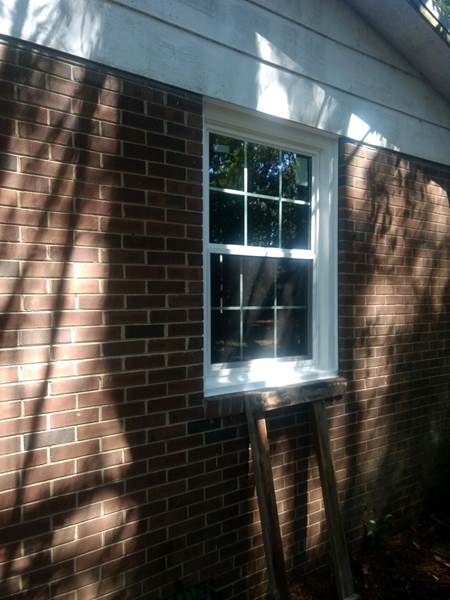 single window on brick house