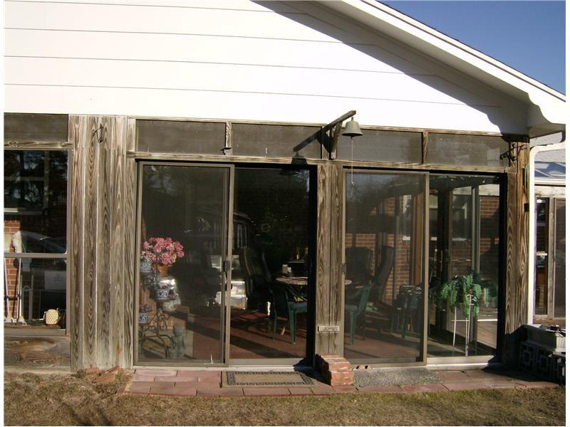 rustic wooden sunroom addition