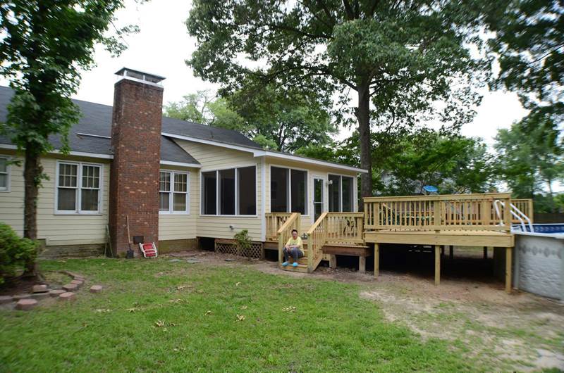 side view of sunroom and deck