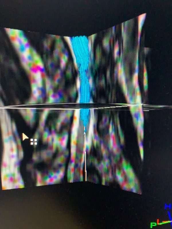 A computer screen shows a colorful image with the letters pl on it