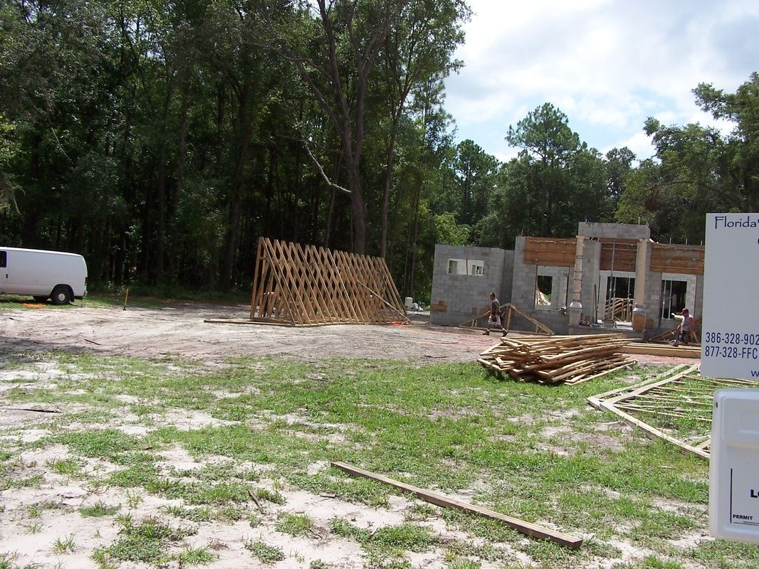 A construction site with a white van in the background