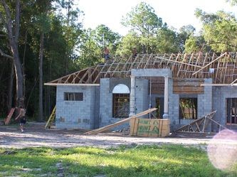 A house that is being built with a sign that says point a