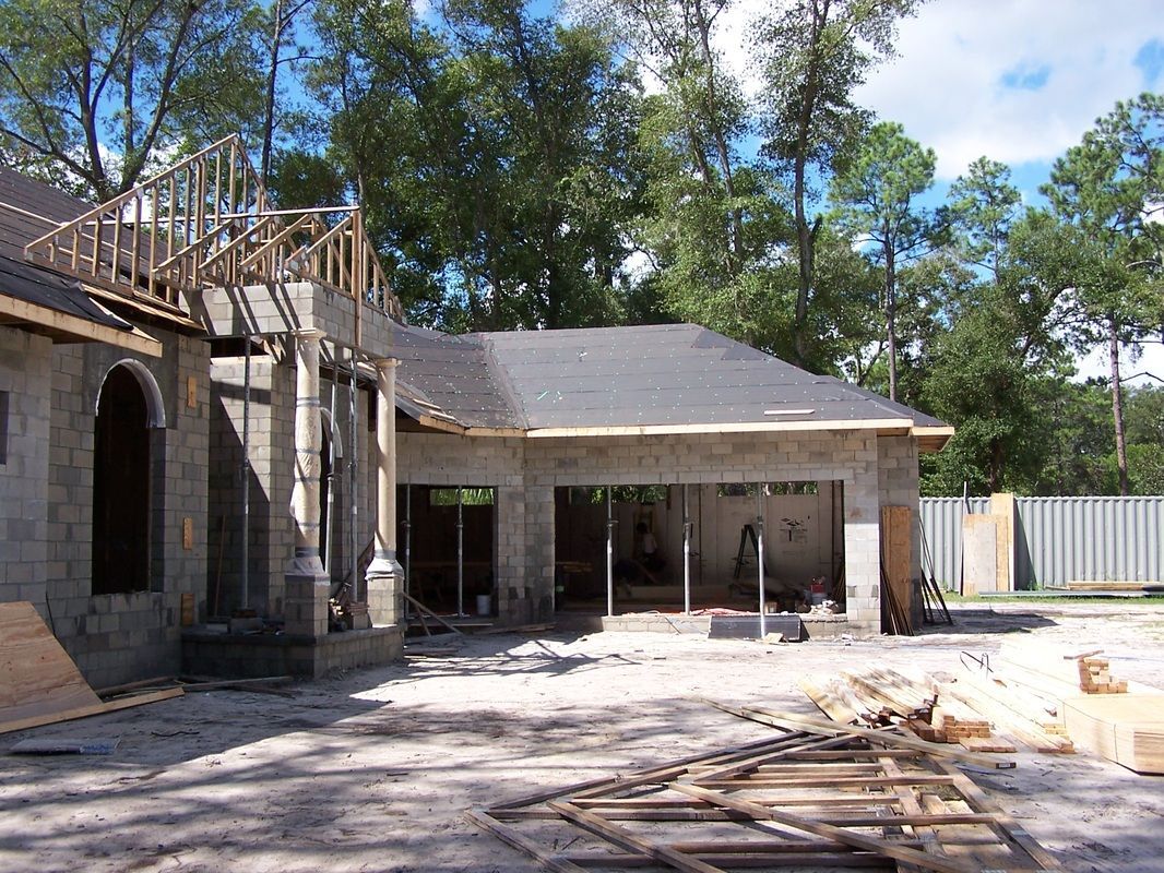 A house is being built in the middle of a forest.