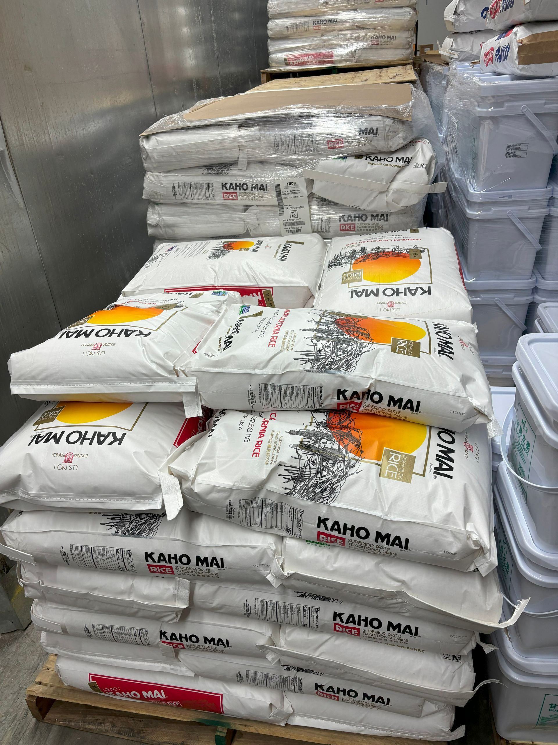 Bags of Kaho Mai rice in a warehouse.