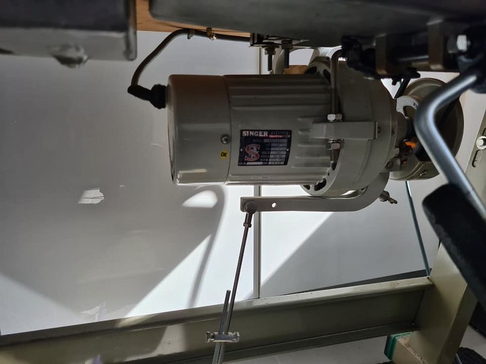 A Motor is Hanging From the Ceiling of a Sewing Machine — James Hunter Mobile Sewing Machine Mechanic in Noosa, QLD