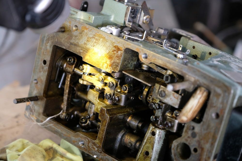 A Close Up of a Machine With a Lot of Parts on It — James Hunter Mobile Sewing Machine Mechanic in Battery Hill, QLD