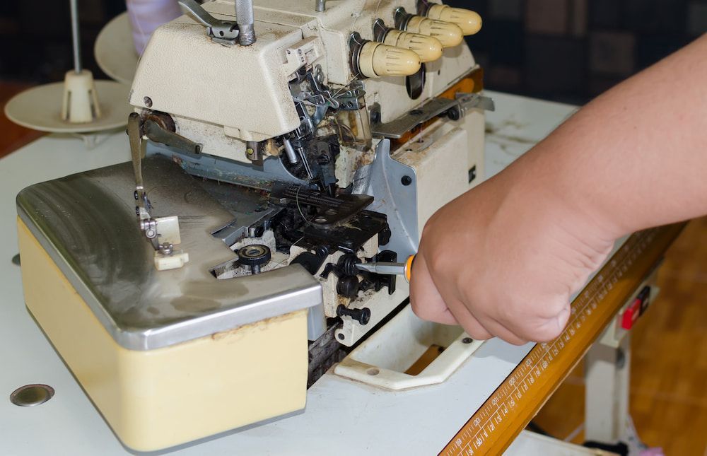 A Person is Working on a Sewing Machine — James Hunter Mobile Sewing Machine Mechanic in Battery Hill, QLD