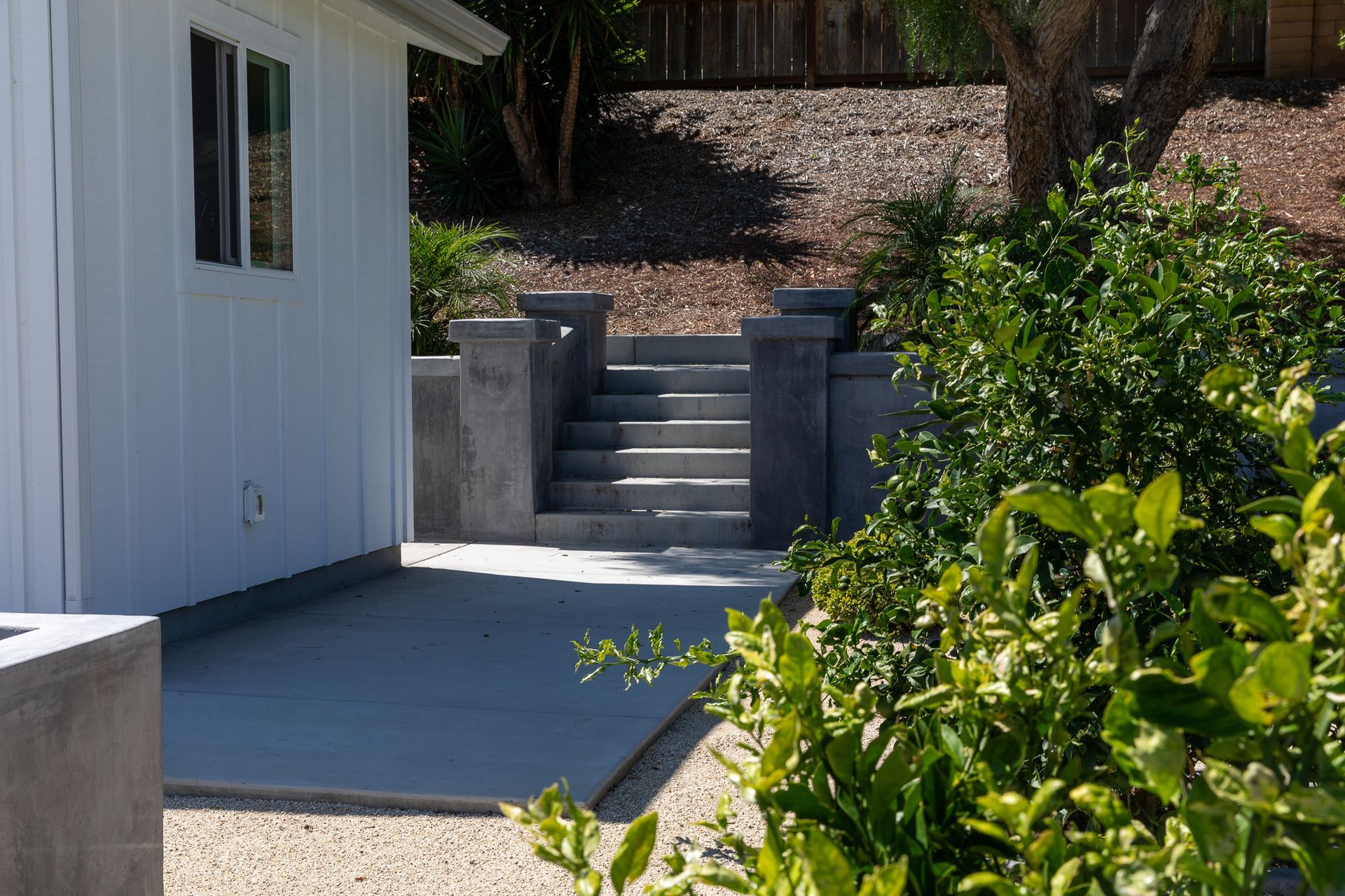 A white house with stairs leading up to it