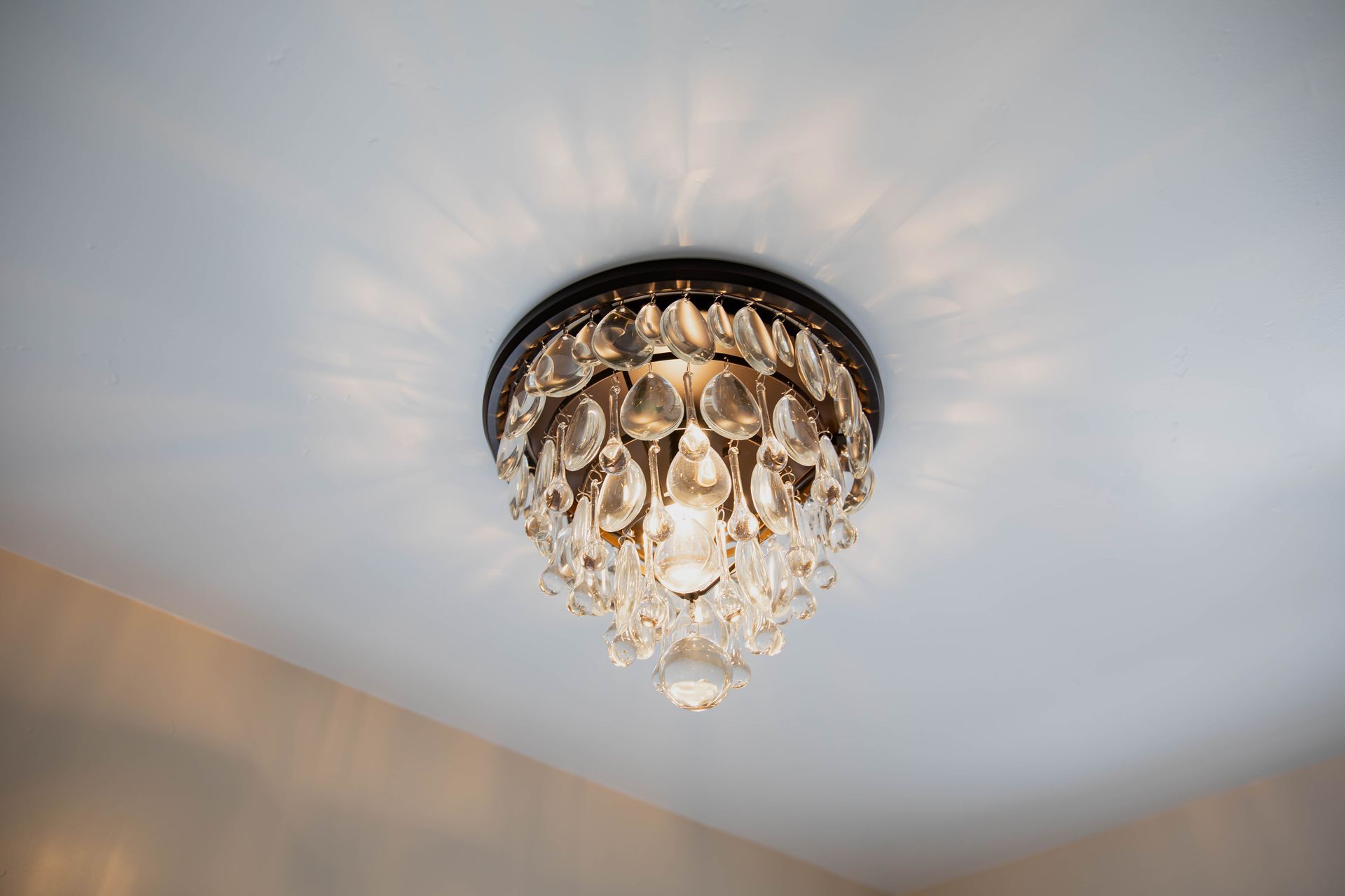 A chandelier is hanging from the ceiling of a room.