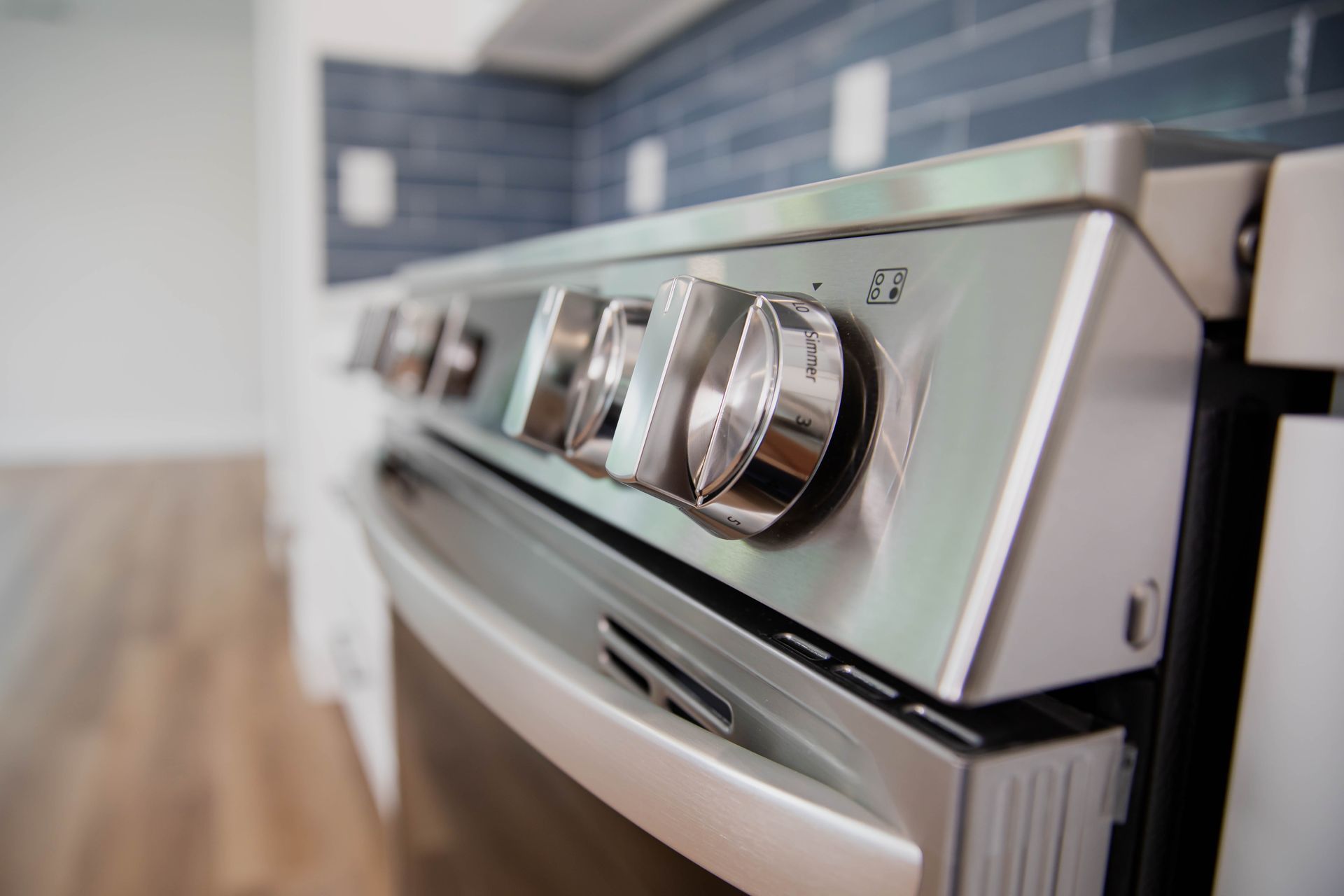 A close up of a stainless steel stove and oven in a kitchen.