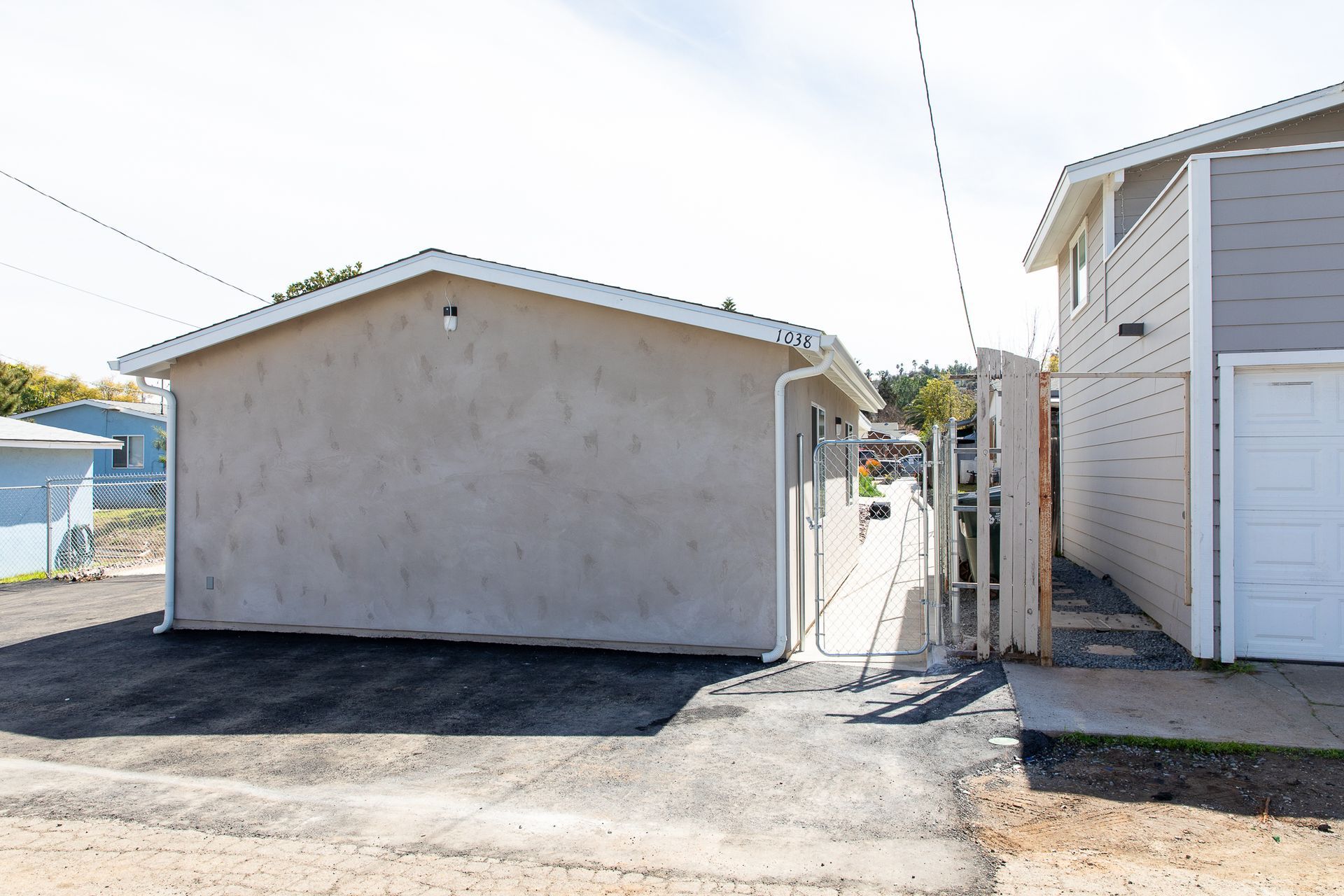 A small house with a garage next to it